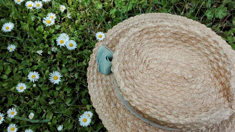Straw hat lying on the grass