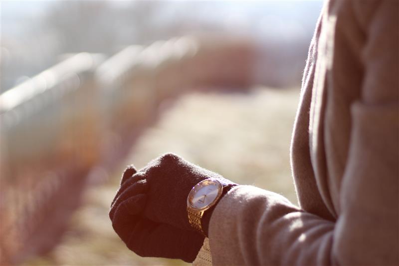 Woman hands and watch in winter